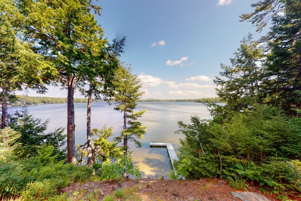 Waterfront A-frame on George’s Pond with views, private dock, beach, kayaks, SUP