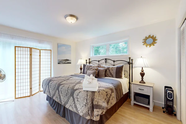 Sunny coastal retreat with deck, grill, beach, dock, & ocean access