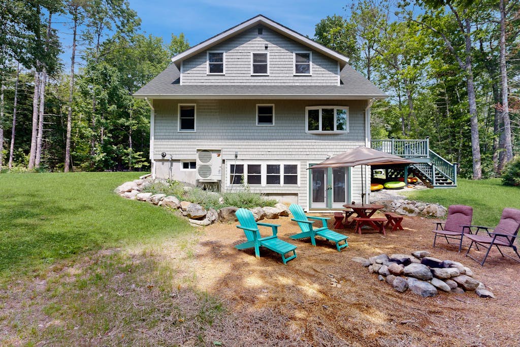 Sunny, lakefront home on South Pond with private dock, great deck & firepit
