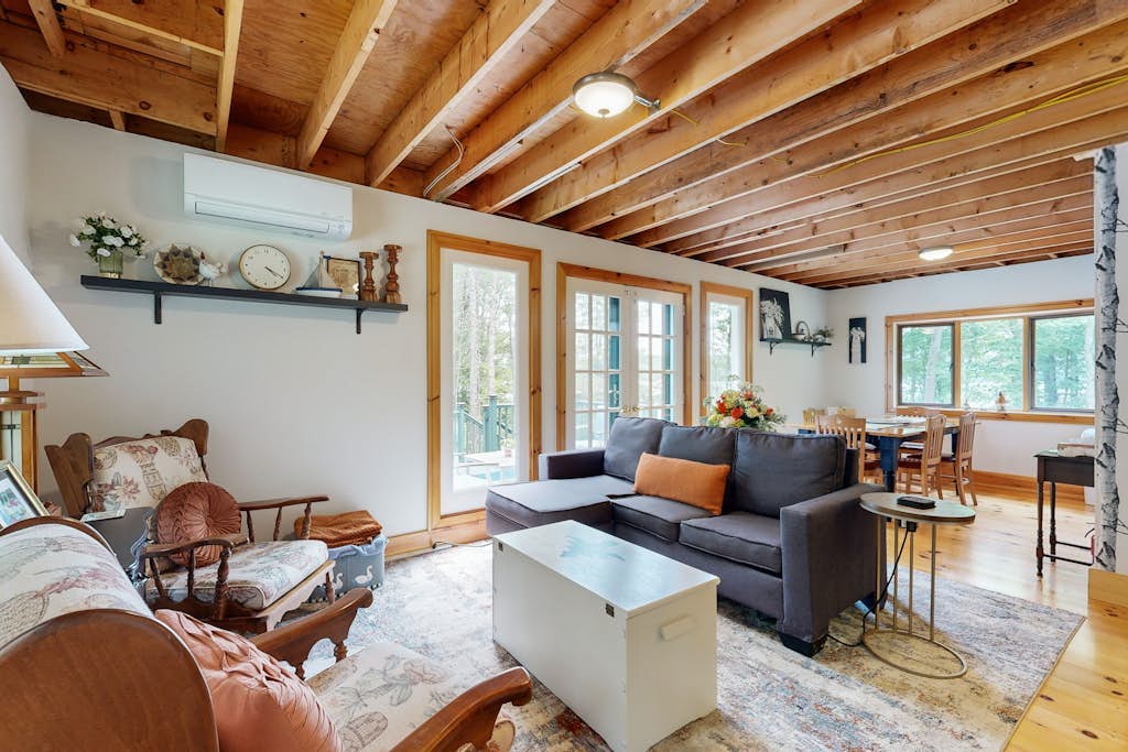 Sunny, lakefront home on South Pond with private dock, great deck & firepit