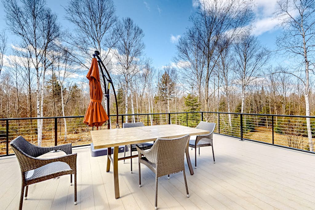 Dog-friendly apartment by Moosehead Lake with sprawling deck & firepit