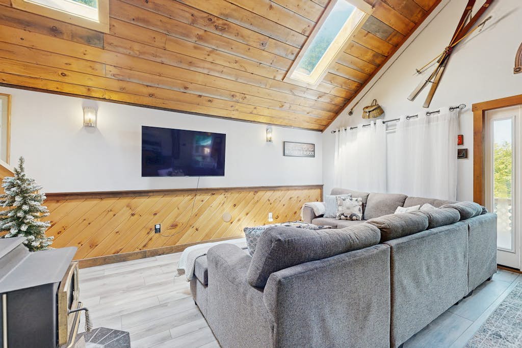 Scenic retreat with a spacious deck, gas fireplace, and glimpses of Moosehead Lake