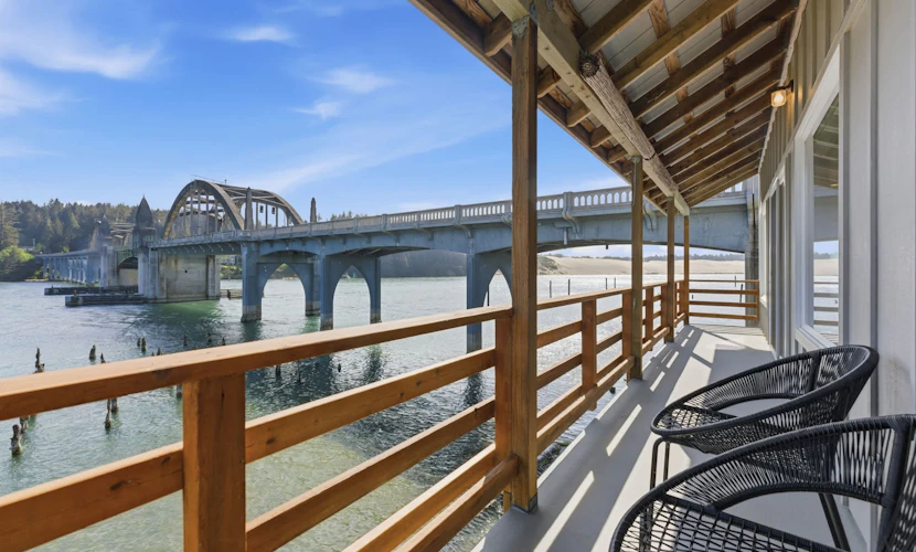Incredible Riverfront Oasis with Wraparound Deck & Cozy Interior!