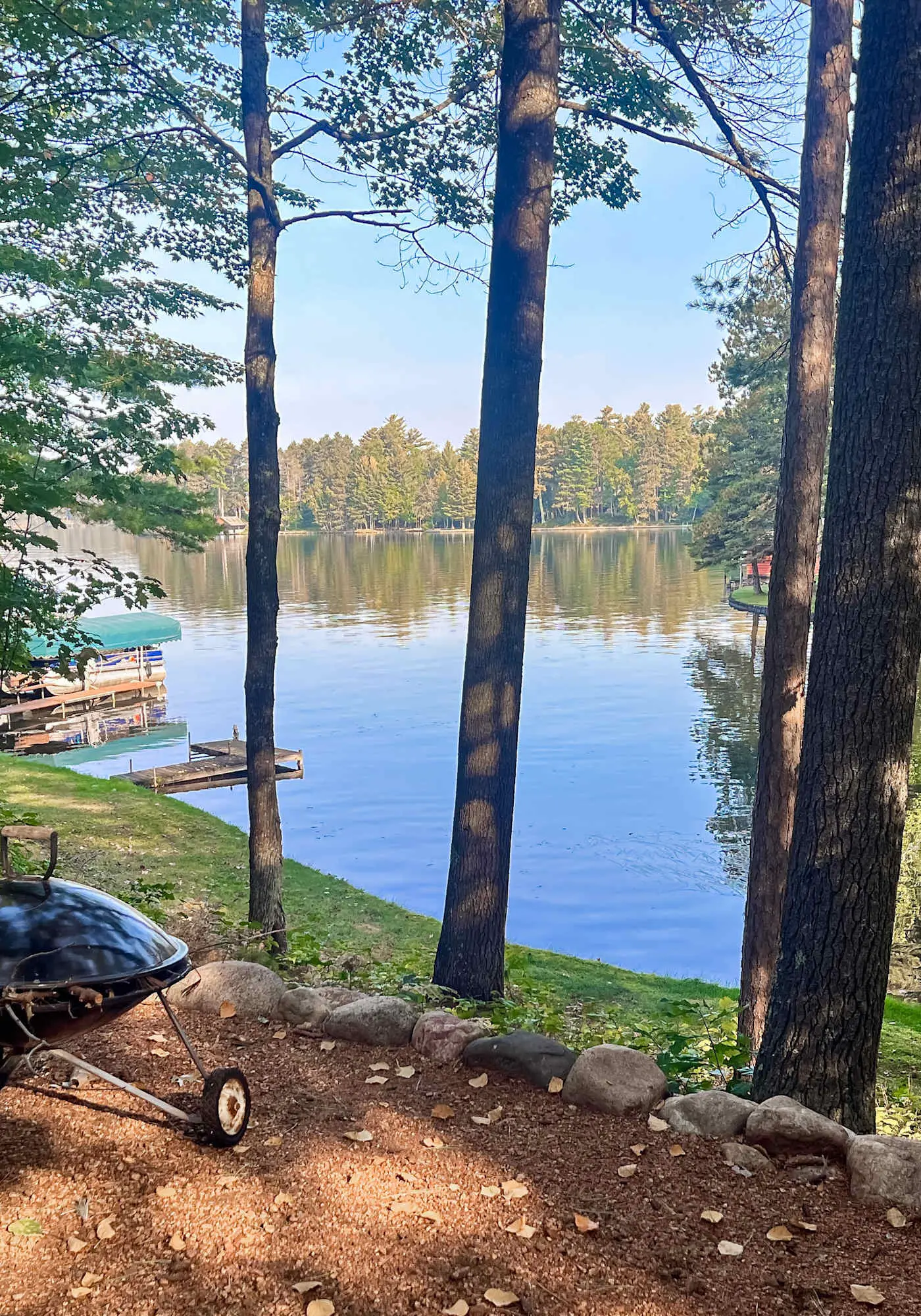 Lakefront escape on Rest Lake with dock, firepit & bike trail access