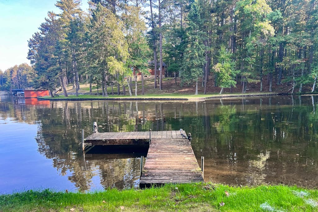 Lakefront escape on Rest Lake with dock, firepit & bike trail access