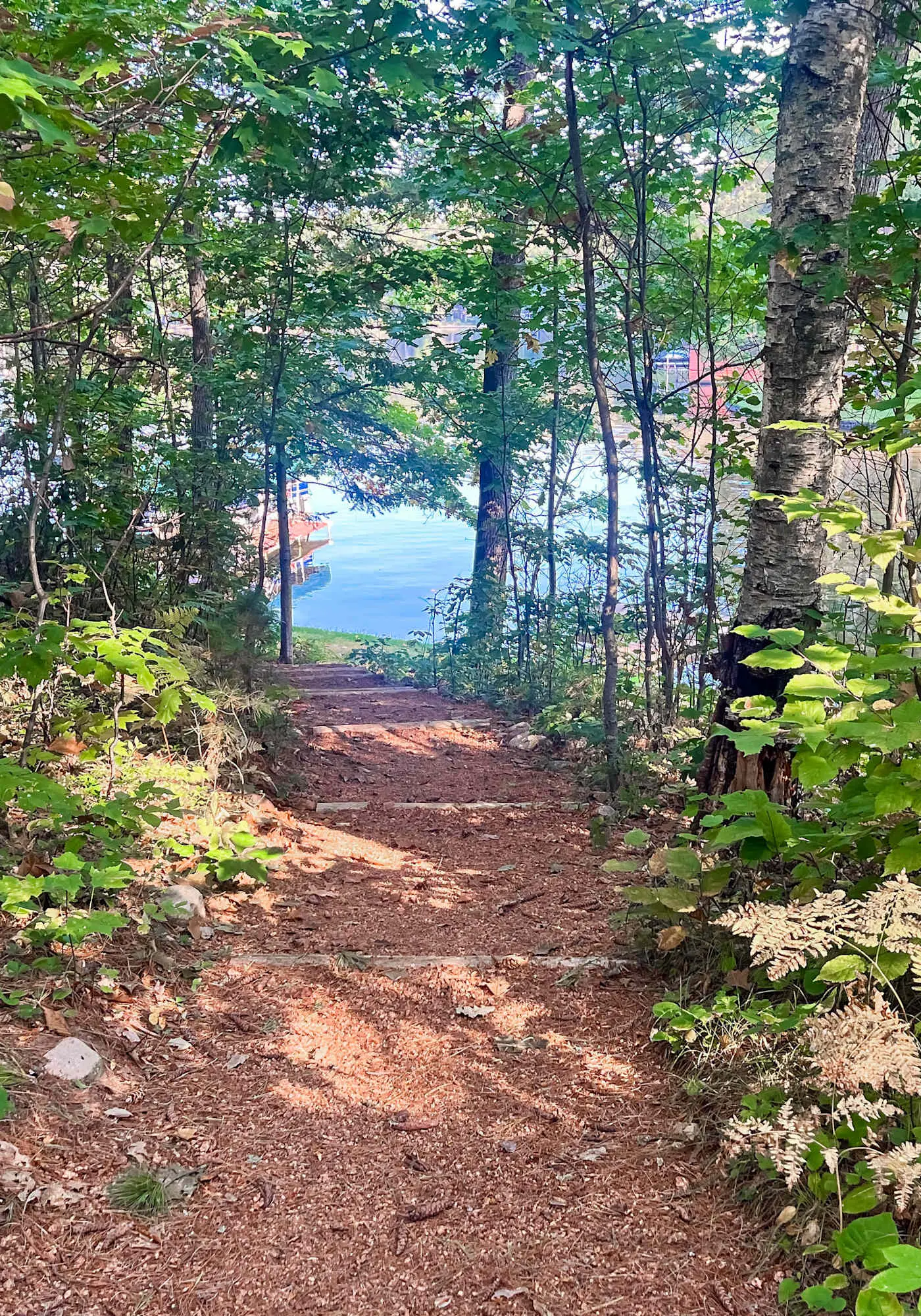 Lakefront escape on Rest Lake with dock, firepit & bike trail access