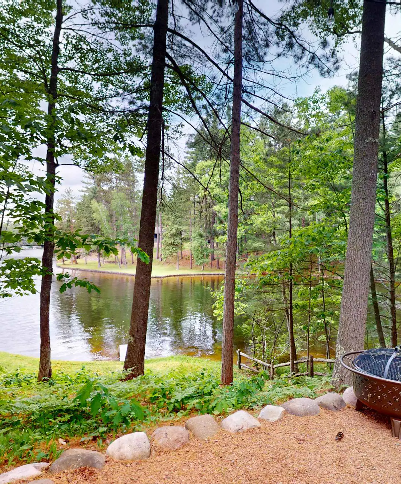 Lakefront escape on Rest Lake with dock, firepit & bike trail access