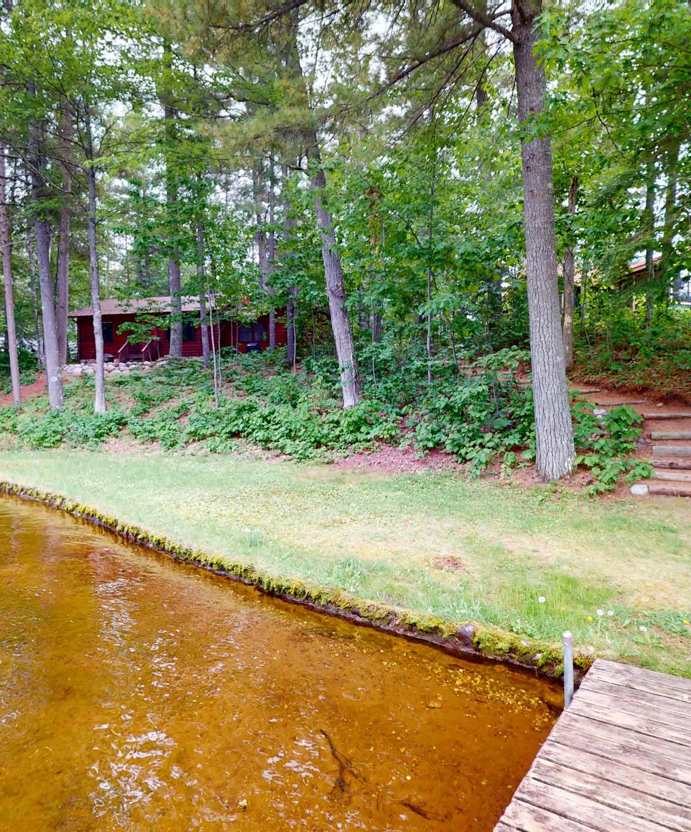 Lakefront escape on Rest Lake with dock, firepit & bike trail access