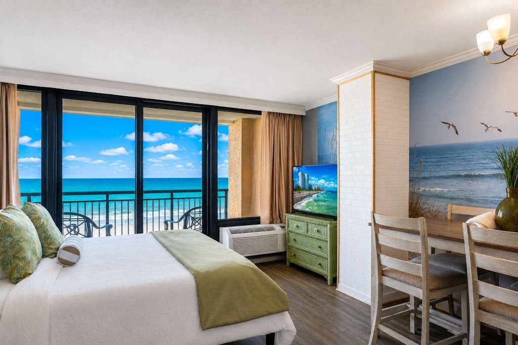 Enjoy breathtaking oceanfront views at the Caravelle Resort in Myrtle Beach! This fully updated 6th-floor King-suite features fresh paint, new flooring, brand-new mattresses, updated furniture, a new TV, modern appliances, and more. The private entrance offers added convenience and privacy, making it feel like a home away from home. With all the comforts of a hotel room but more spacious, this oceanfront retreat is perfect for your next beach getaway!