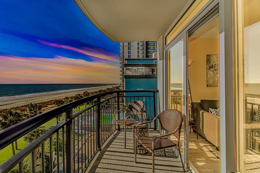Check out this direct oceanfront vacation rental at Boardwalk Resort in Myrtle Beach, SC. This oceanfront vacation rental is fully furnished with everything you need for your next vacation. This 1 bedroom, 2 bath apartment features 2 full beds, 1 full size sleeper sofa, 1 full size murphy bed, and will comfortably accommodate 8 guests. This rental is a true 1-bedroom condo, and our guests enjoy the separation between rooms and the privacy that is offered. The bedroom area features 2 full beds, TV with basic cable, dresser for storage, closet, AC and Heat unit, a private balcony, and a private full-size bathroom. The bathroom features a tub/shower, granite countertop, new faucet, and toilet. Our guests love having access to their own private balcony in the bedroom. There are a total of 2 balconies in this condo.