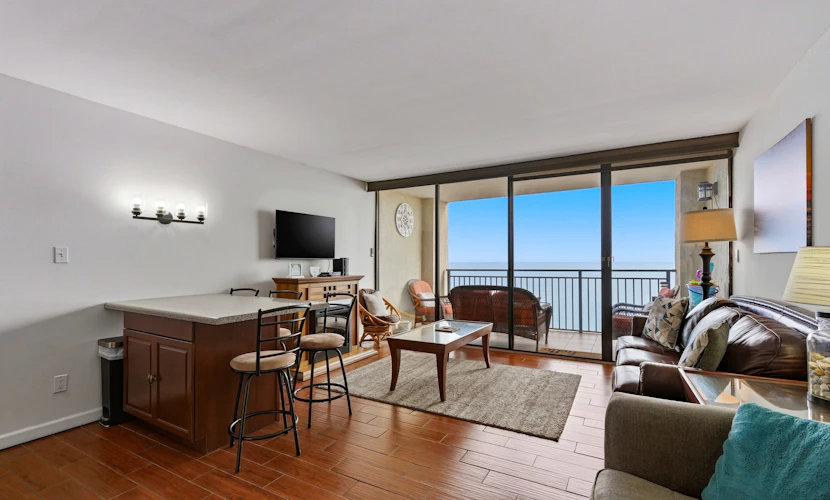 Step into a serene escape where every detail is designed for relaxation and comfort. This stunning 1-bedroom, 1-bathroom oceanfront condo at Ocean Forest Plaza offers breathtaking views that stretch across the horizon and can be enjoyed from nearly every corner of the space. With a full floor-to-ceiling glass wall in the living room, the sliding doors open onto your private balcony, inviting the soothing sounds of the waves and the fresh ocean breeze inside.