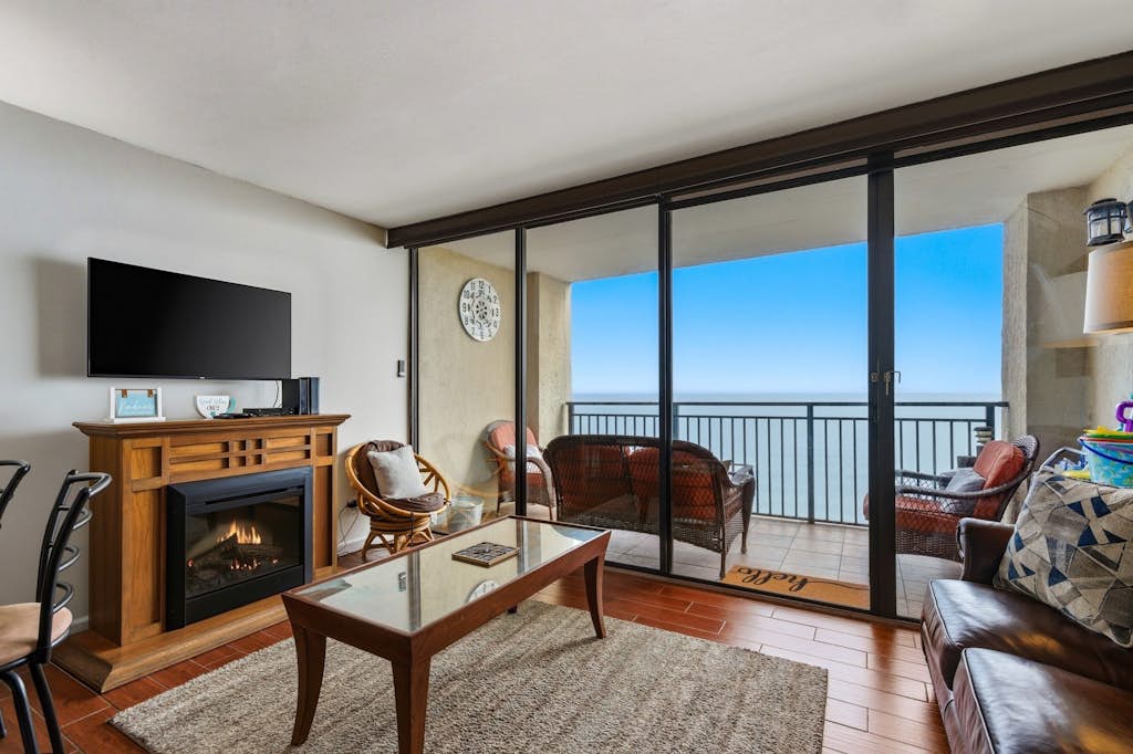 Step into a serene escape where every detail is designed for relaxation and comfort. This stunning 1-bedroom, 1-bathroom oceanfront condo at Ocean Forest Plaza offers breathtaking views that stretch across the horizon and can be enjoyed from nearly every corner of the space. With a full floor-to-ceiling glass wall in the living room, the sliding doors open onto your private balcony, inviting the soothing sounds of the waves and the fresh ocean breeze inside.