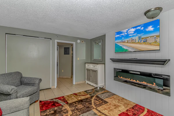 The search for your next vacation stops here! Check out this 3rd floor, completely updated, ocean view condo at the Landmark Resort in Myrtle Beach. This ocean view 1 bedroom apartment is fully furnished with 1 king bed, 1 full size murphy bed, 1 queen sleeper sofa, and will comfortably accommodate 6 guests. This unique layout offers oversized living space for our guests. Other rentals at the resort are much smaller, but this layout features an open floor plan and doesn't feel cramped! Our guests enjoy having their own private balcony where they can relax and enjoy both the views of the ocean as well as the pools.