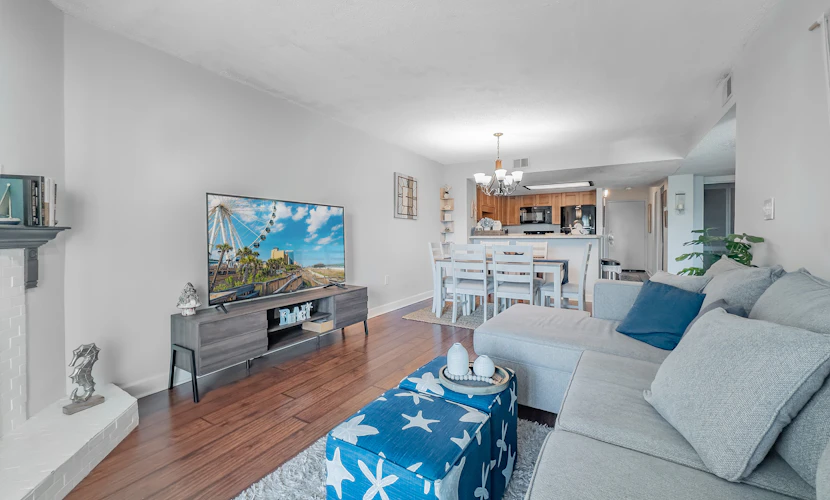 Take a look at this charming three bedroom two bath condo just a few blocks from the ocean in the perfectly situated Sea Mark Tower. Warm, inviting, and thoughtfully designed, this one of a kind space offers a king bed, a queen bed, and a twin sized sleeper sofa so up to five guests can settle in comfortably and enjoy a relaxing stay.