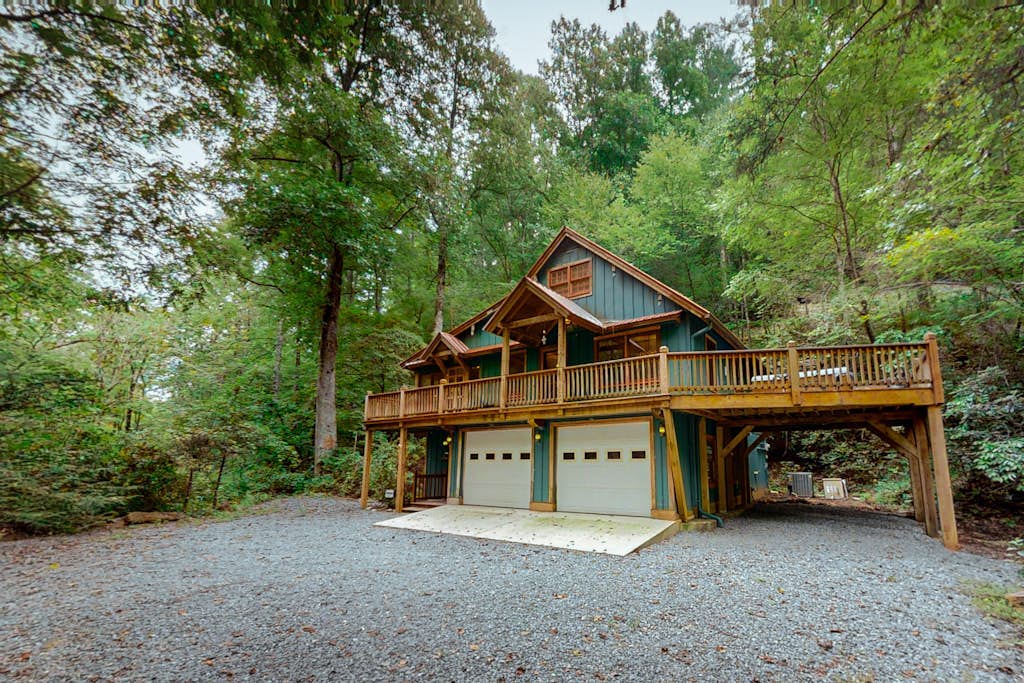 Picturesque cabin on trout creek with mountain views, private hot tub, & WiFi