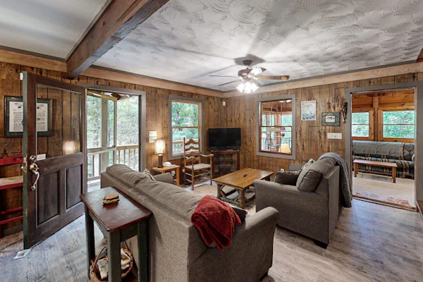 Picturesque cabin on trout creek with mountain views, private hot tub, & WiFi
