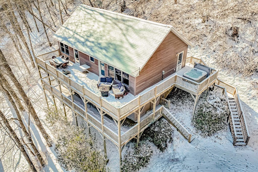 Elevated mountain-view cabin with private hot tub, 2 decks, firepit, & grill