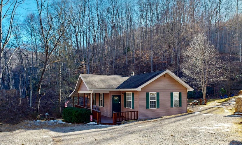 Mountain view home with a fireplace with beautiful view of the creek