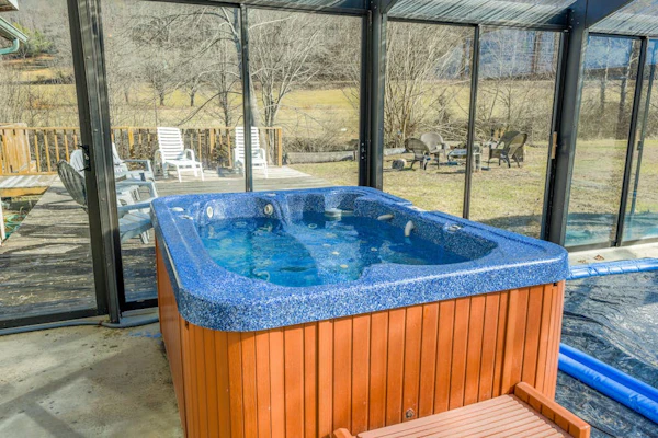 Creek-side home with private hot tub, game room, firepit, deck & mountain view