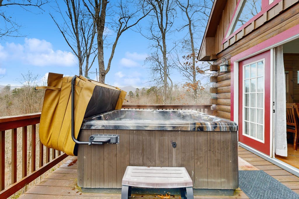 Secluded cabin with hot tub, fire pit, & close to local trails!