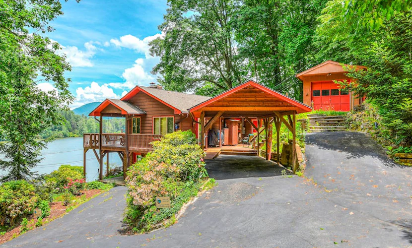 Upper unit lakefront home with lake views, wood fireplace, shared outdoor pool