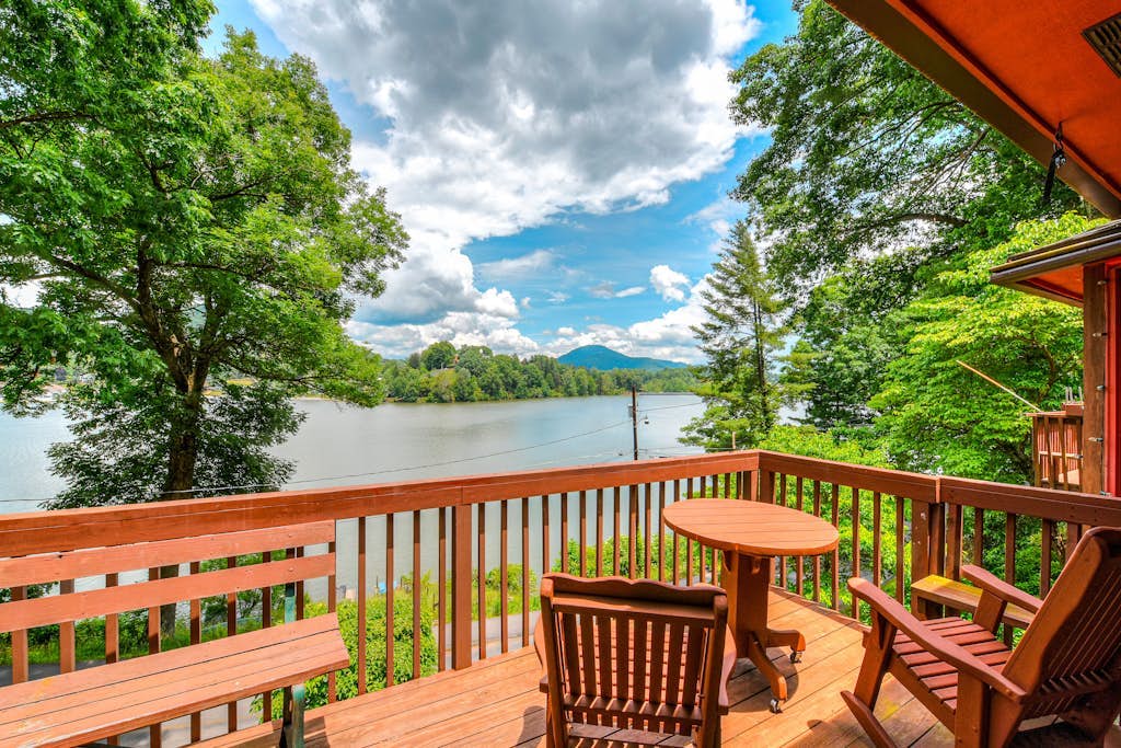 Upper unit lakefront home with lake views, wood fireplace, shared outdoor pool