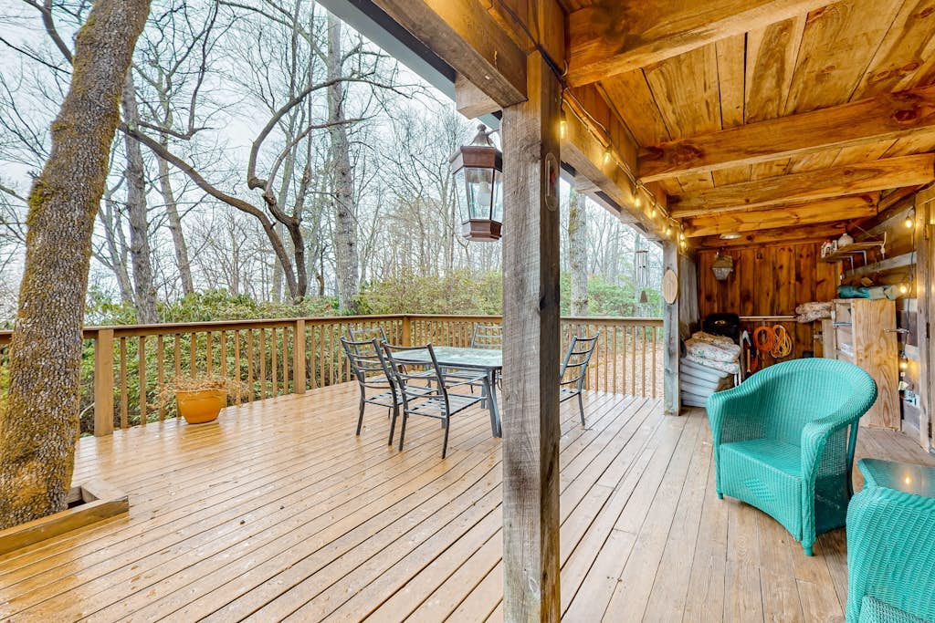 Secluded dog-friendly cabin with firepit, large deck, forest views, & wood stove