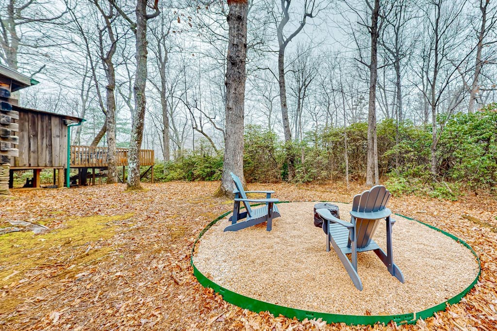 Secluded dog-friendly cabin with firepit, large deck, forest views, & wood stove