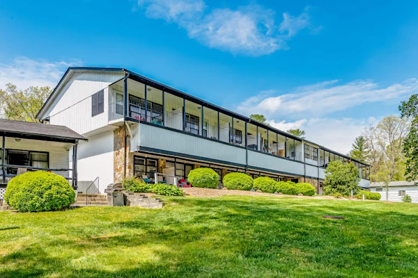 Lakefront corner condo with canoes, resort pool, tennis & firepit - dogs welcome