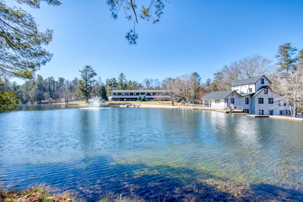Lakefront corner condo with canoes, resort pool, tennis & firepit - dogs welcome