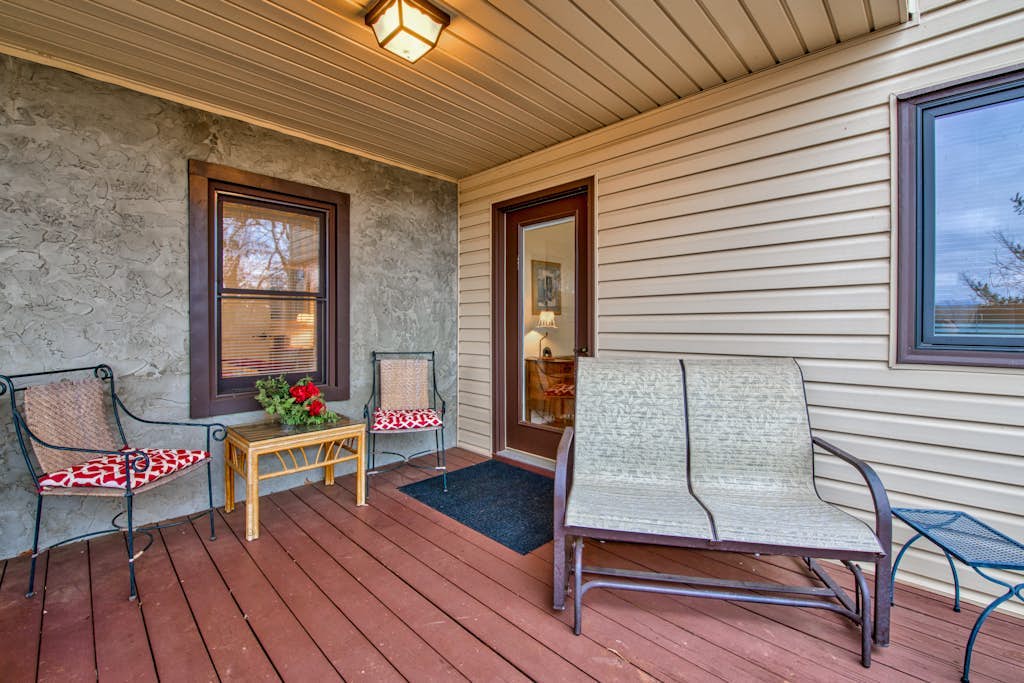 Lower-level lake retreat with mountain views, pool, central AC, deck, grill
