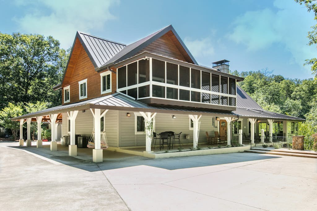 Riverside opulence with game room, private heated pool, hot tub & firepit