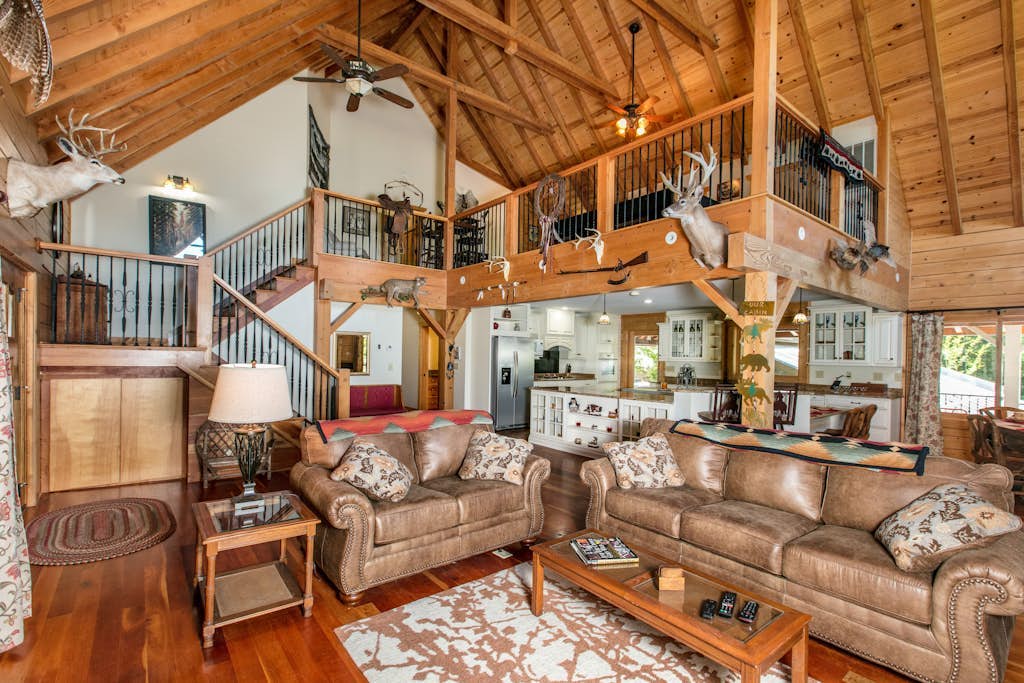 Riverside opulence with game room, private heated pool, hot tub & firepit