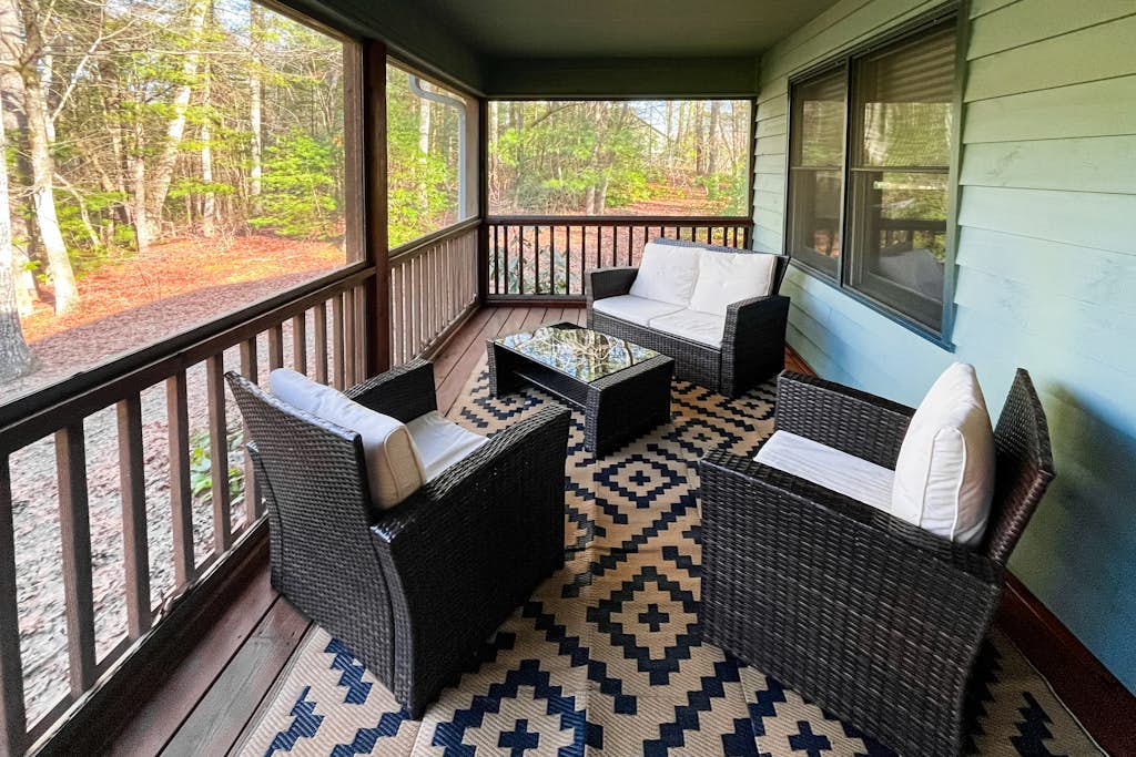 Mountainside abode with a wood stove, firepit, grill, sunroom, AC, and W/D