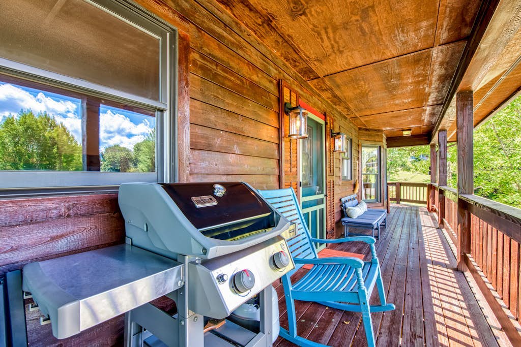 Lakeside retreat with water views, pool, wraparound deck, patio & game room