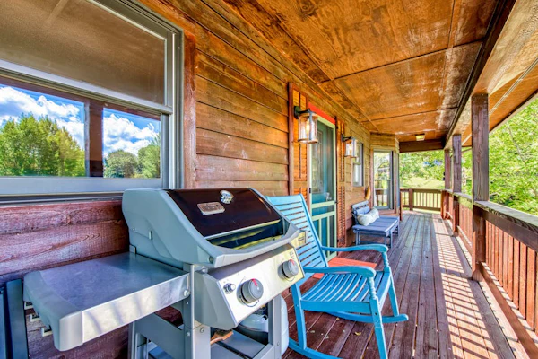 Lakeside retreat with water views, pool, wraparound deck, patio & game room