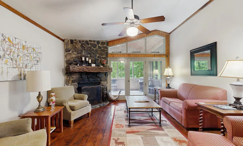 Classic cabin on Hogback Lake with private dock, game room, firepit, & fireplace