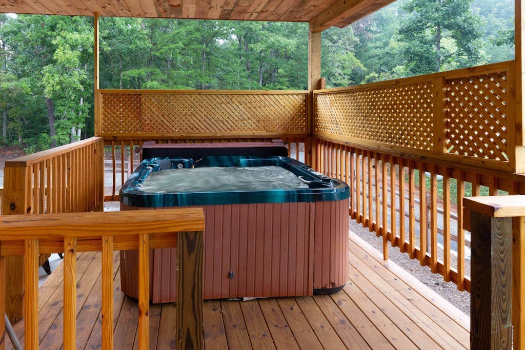 Mountain-view lodge home with private hot tub & large covered porch