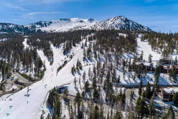 Ski-in/out condo with mountain view, private hot tub, deck & fireplace