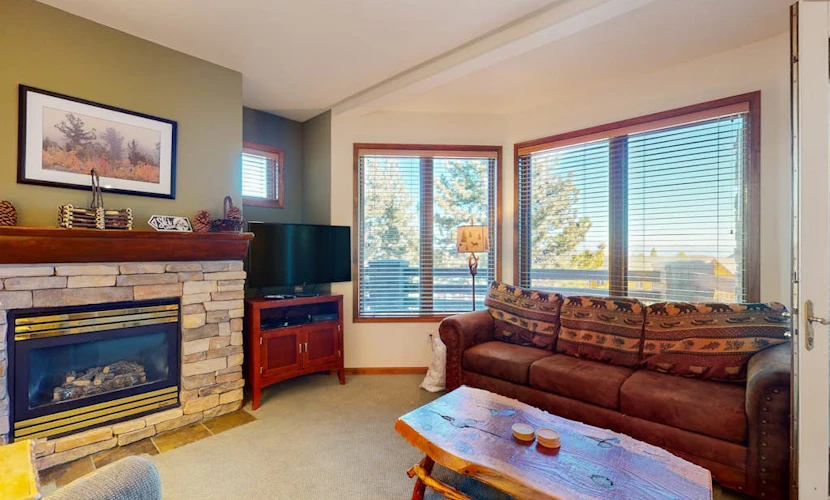 This Ski-In/Ski-Out Condo Features Sweeping Mountain Views & Shared Hot Tub