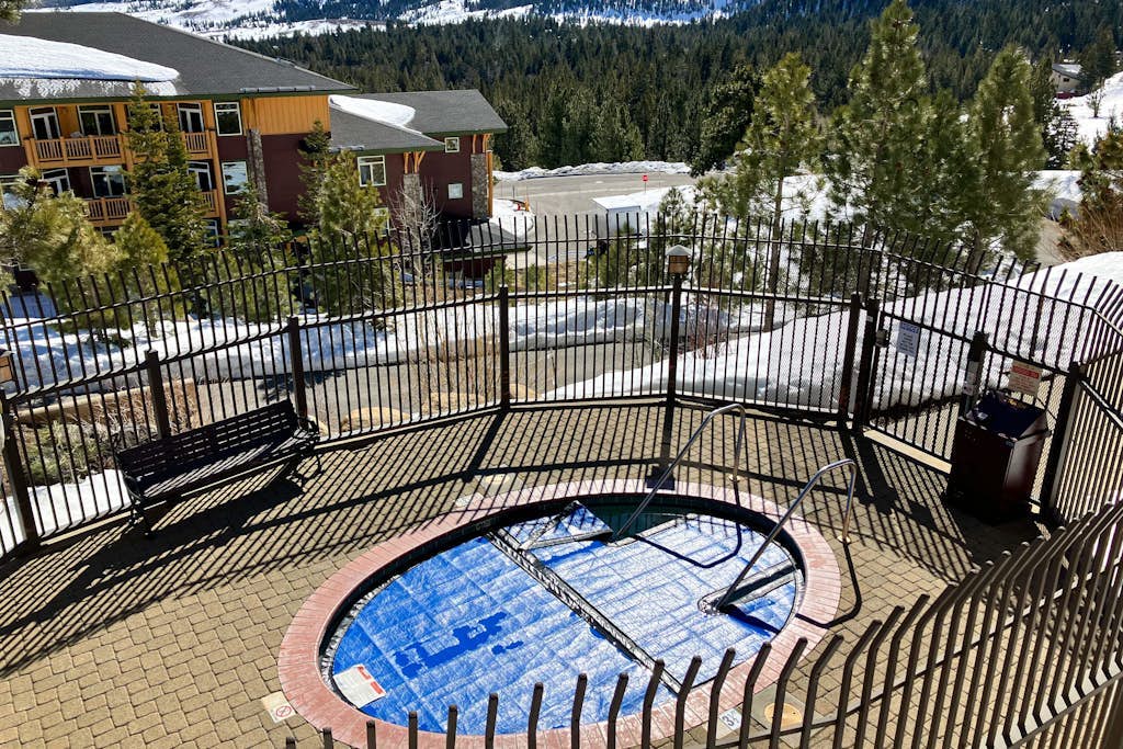 This Ski-In/Ski-Out Condo Features Sweeping Mountain Views & Shared Hot Tub
