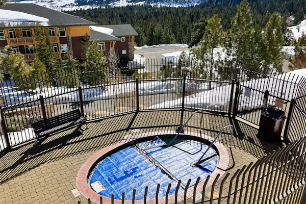 This Ski-In/Ski-Out Condo Features Sweeping Mountain Views & Shared Hot Tub