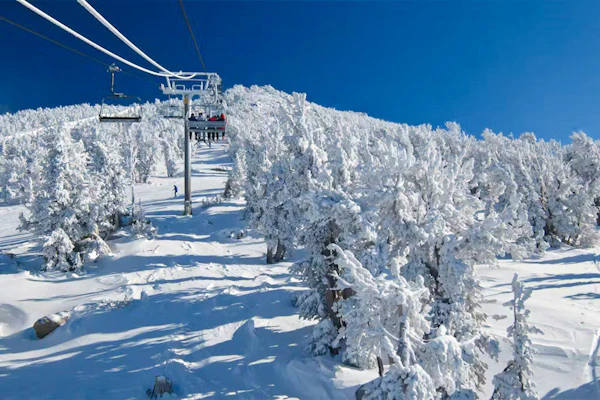 This Ski-In/Ski-Out Condo Features Sweeping Mountain Views & Shared Hot Tub