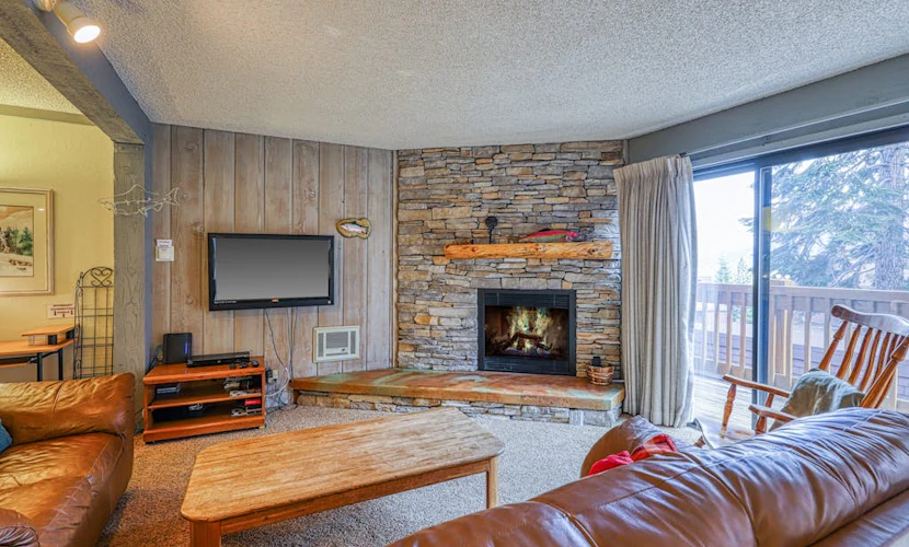 Charming condo with a hot tub, sauna, balcony, deck, game room, & gas fireplace