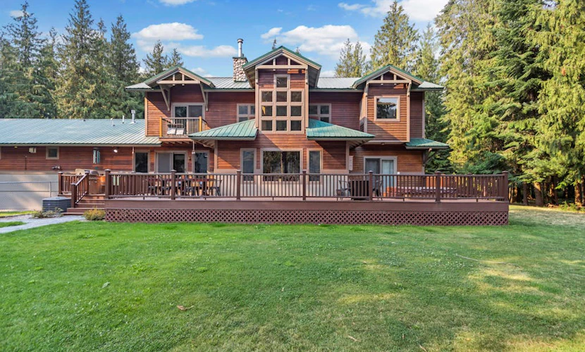 Expansive Riverfront Lodge with Dock, Game Room, Bar & Spacious Deck!