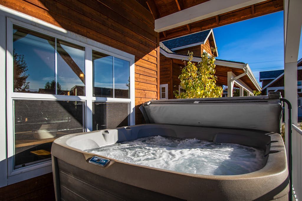 Sunlit, dog-friendly home with hot tub, gas fireplace, & washer/dryer