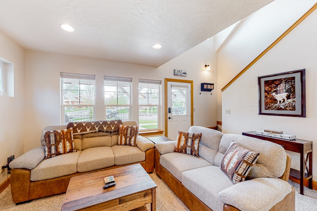 Adorable, two-story home with a furnished front porch, fireplace, & washer/dryer