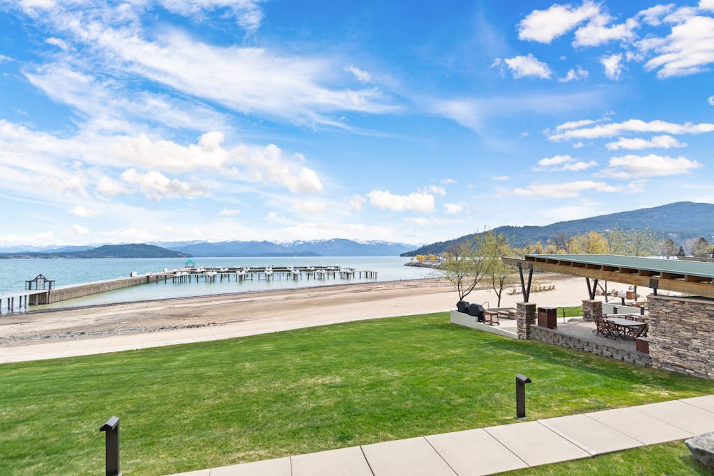 Lake view condo with WiFi, balcony, fireplace, & shared pool/hot tub/grills
