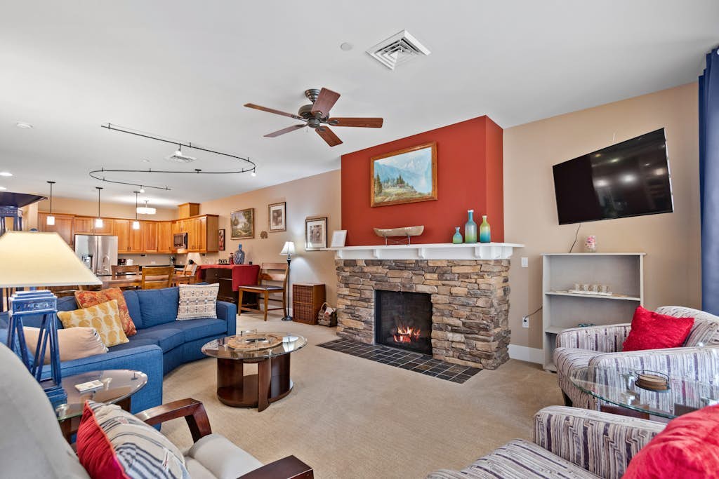 Lake view condo with WiFi, balcony, fireplace, & shared pool/hot tub/grills