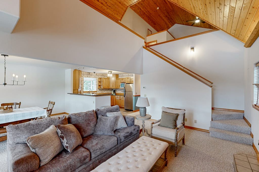 Riverfront home with mountain view, hot tub, deck, WiFi, W/D, & fireplace